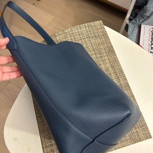 The row N/S park tote in navy blue medium size. Perfect condition.